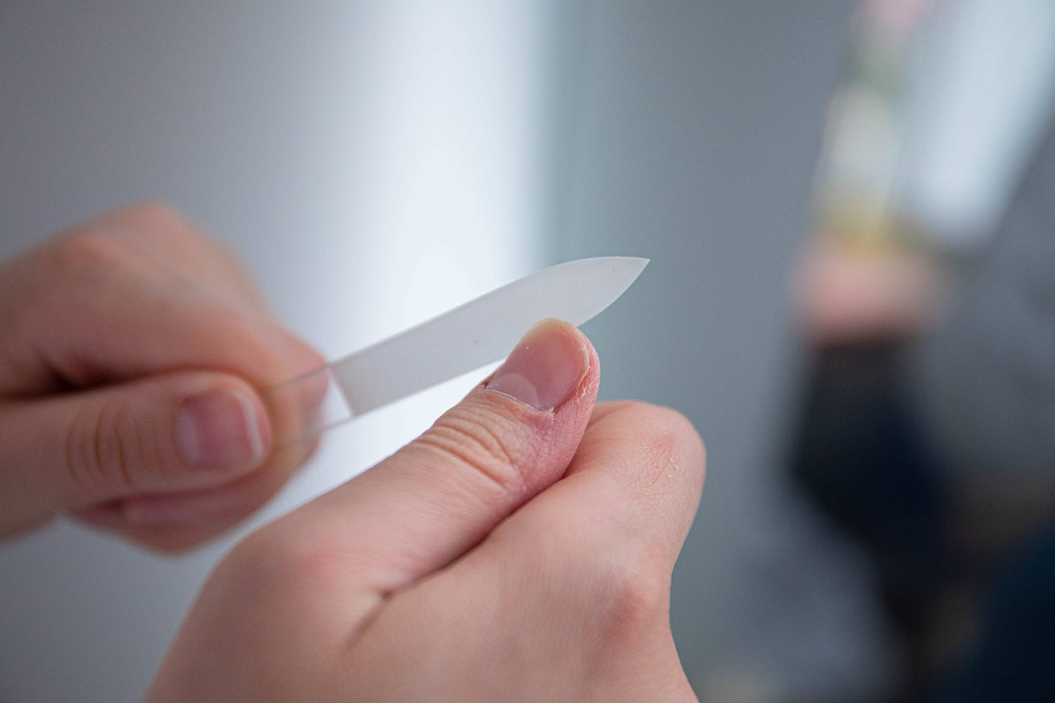 Hands sorting receipts and invoices on a desk